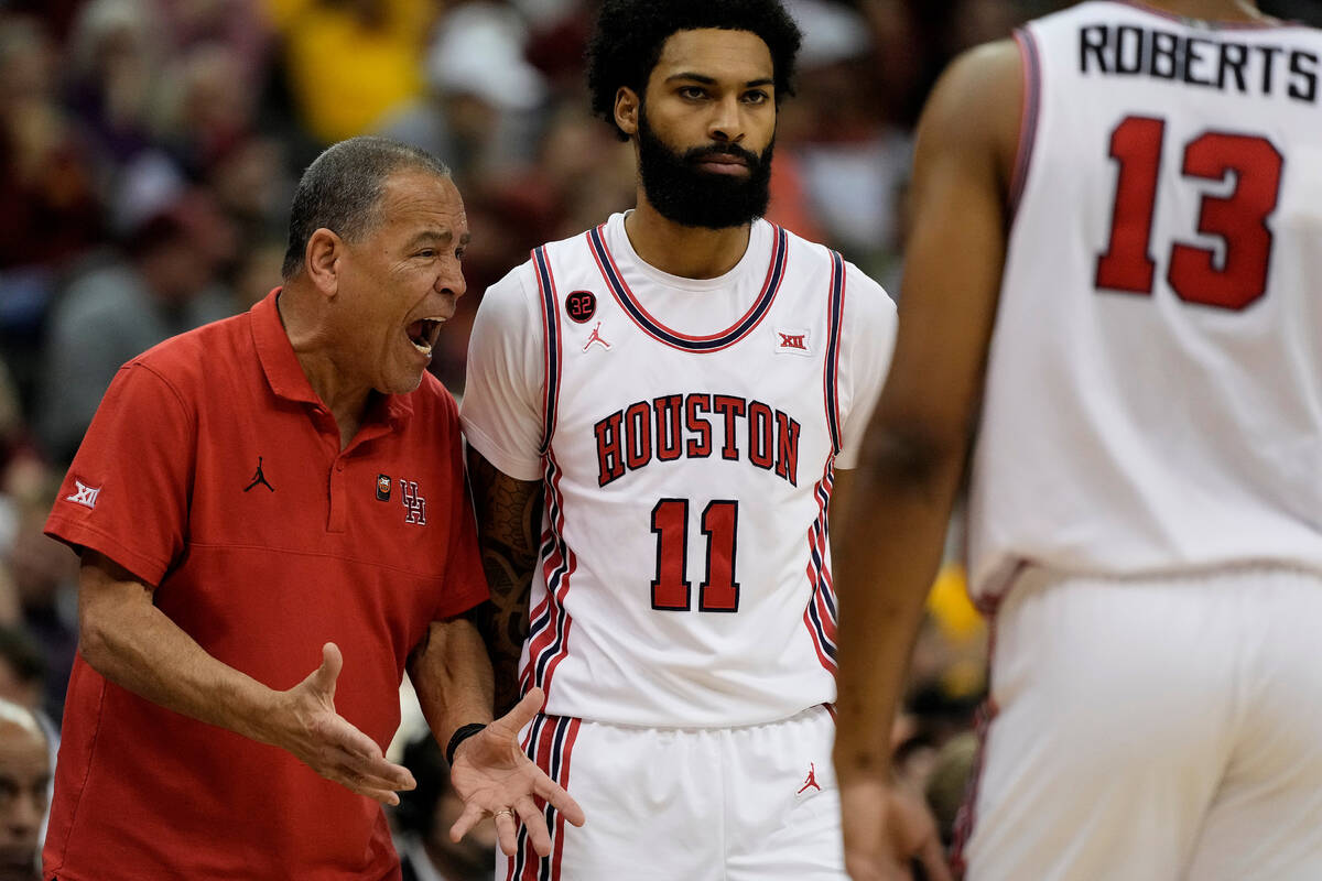 Houston head coach Kelvin Sampson talks to his players during the first half of an NCAA college ...
