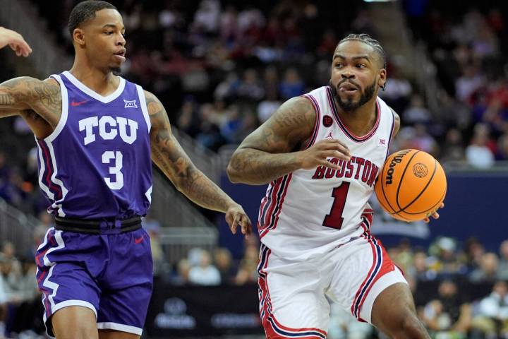 Houston guard Jamal Shead (1) gets past TCU guard Avery Anderson III (3) during the second half ...