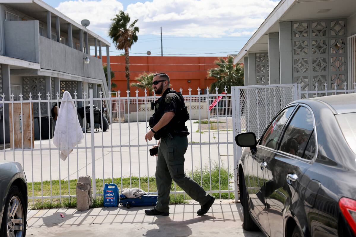 A security officer guards an apartment complex in the 2200 block of East Nelson Avenue in North ...