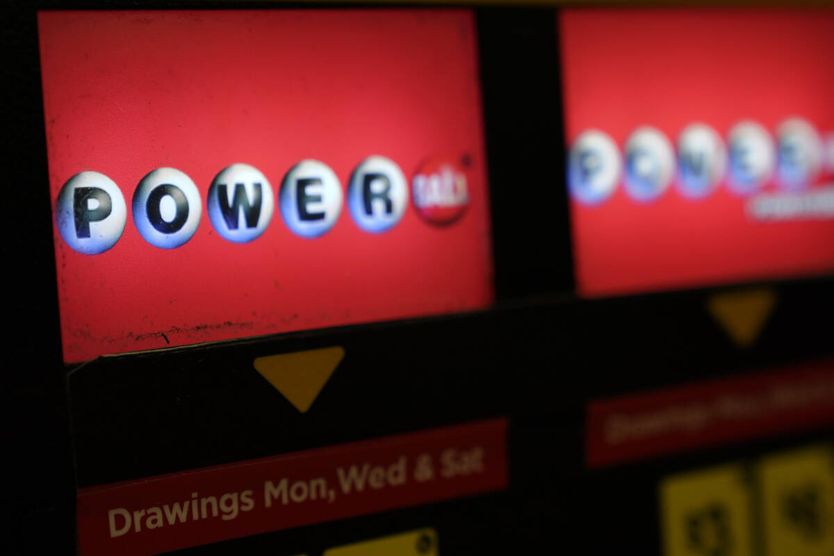 A Powerball lottery ticket vending machine is seen in a convenience store in Northbrook, Ill. ( ...