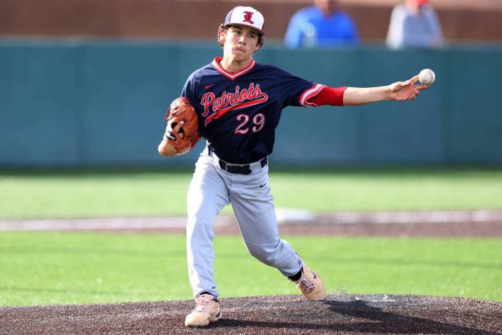 Liberty’s Nicholas Blakeney (29) throws the ball to first base during a baseball game against ...
