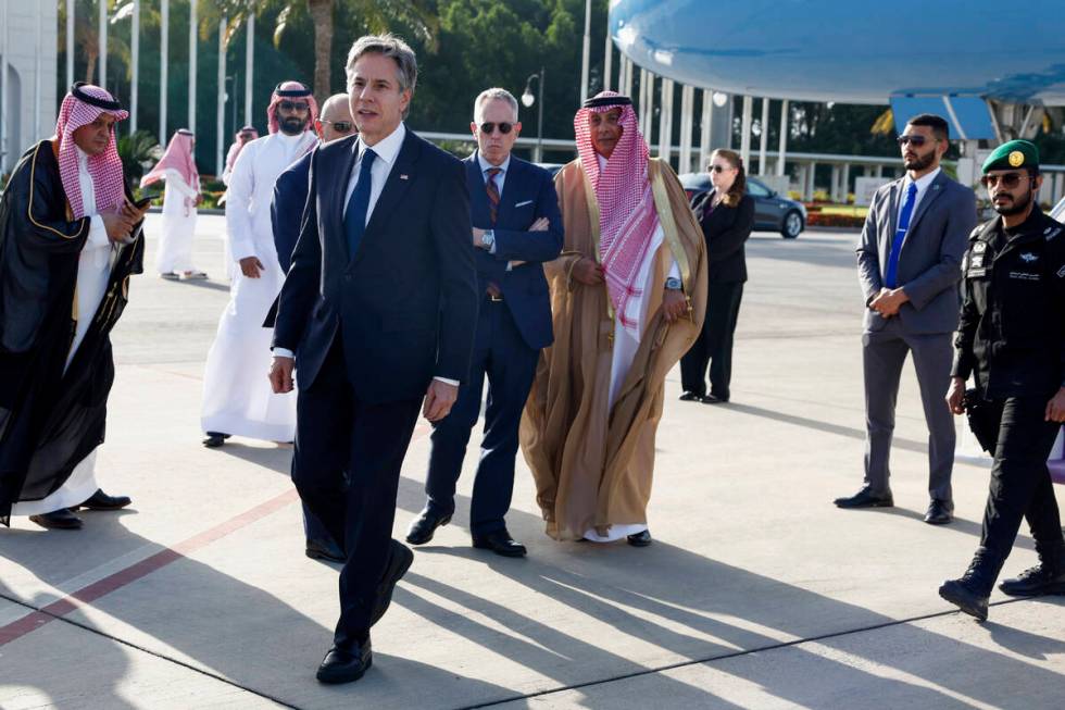 U.S. Secretary of State Antony Blinken walks as he arrives in Jeddah, Saudi Arabia, Wednesday, ...