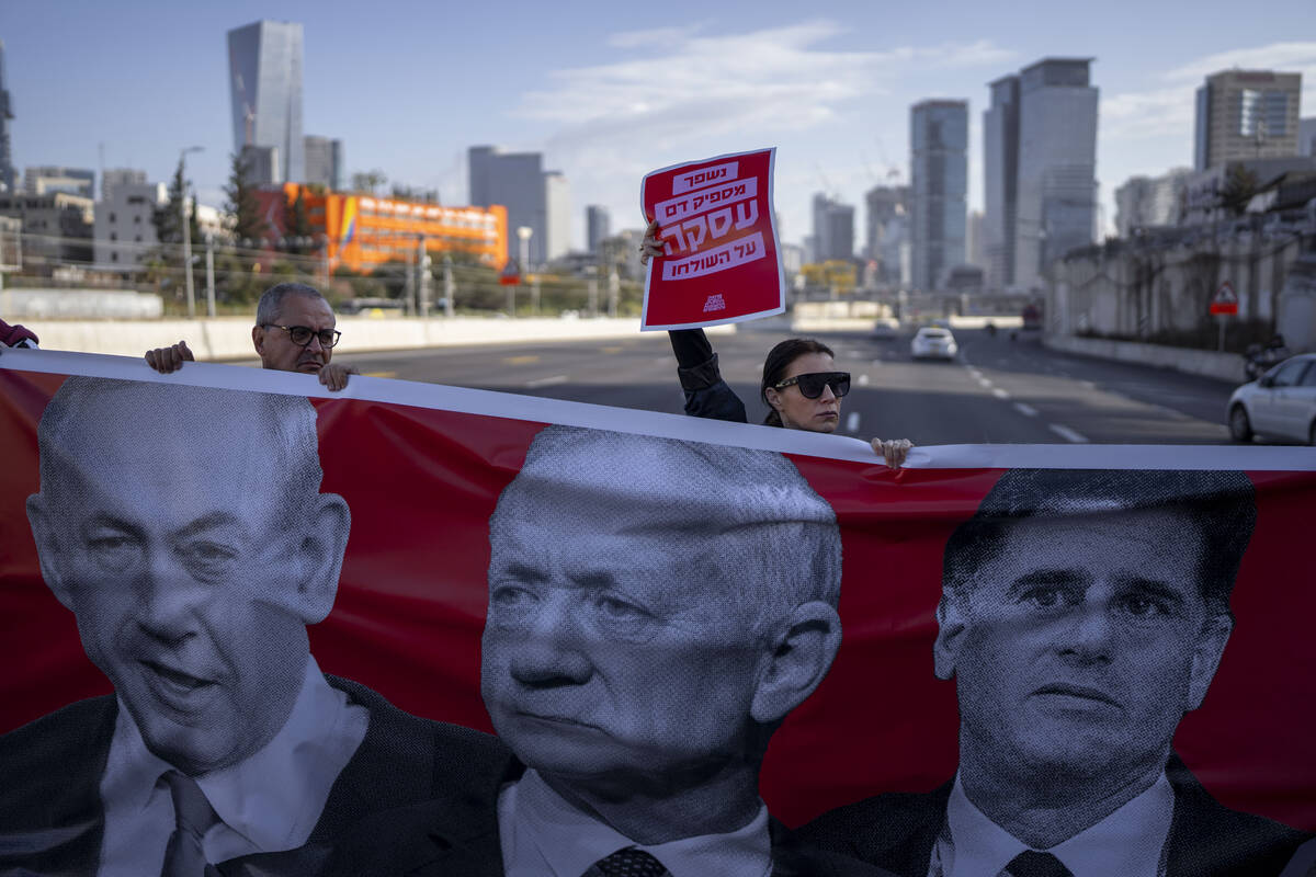 Activists block a highway as they demand the release of the hostages from Hamas captivity in th ...