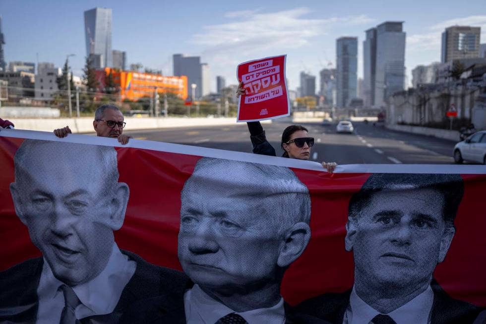 Activists block a highway as they demand the release of the hostages from Hamas captivity in th ...