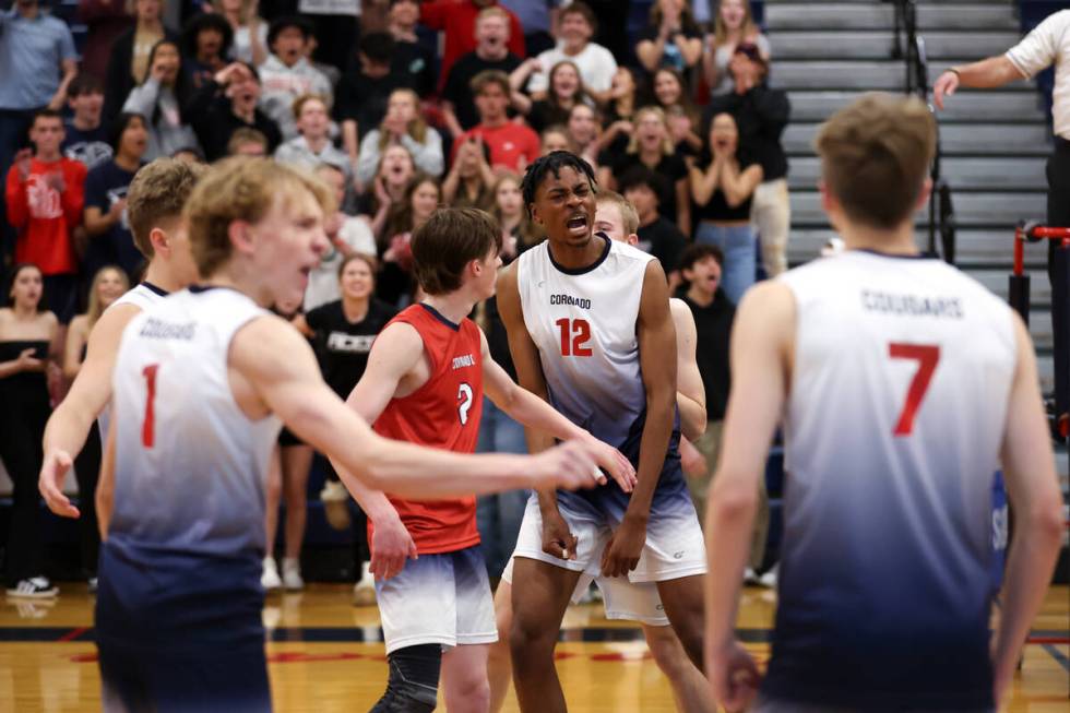 Coronado celebrates a point during a boys high school volleyball match against Arbor View at Co ...