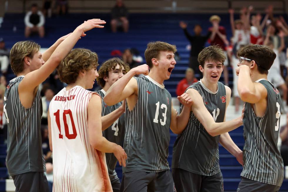 Arbor View celebrates a point during a boys high school volleyball match against Coronado at Co ...