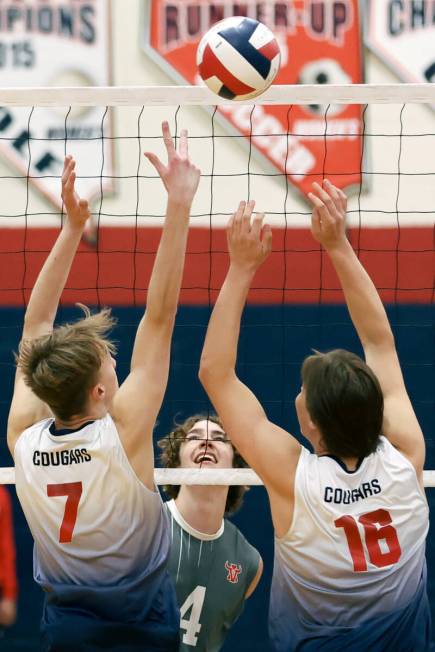 Arbor View opposite hitter Talen Wolf (4) smiles as his hit clears a block by Coronado’s ...