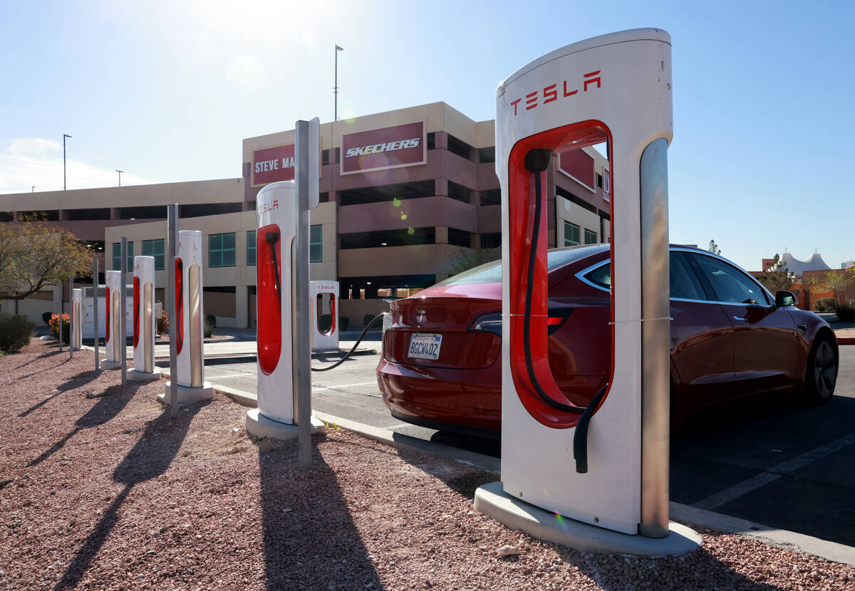 Electric vehicles charge at the Las Vegas North Premium Outlets on Thursday, March 21, 2024. (K ...