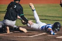 Basic outfielder Andruw Giles (29) tries to slide to home base but is out during a baseball gam ...