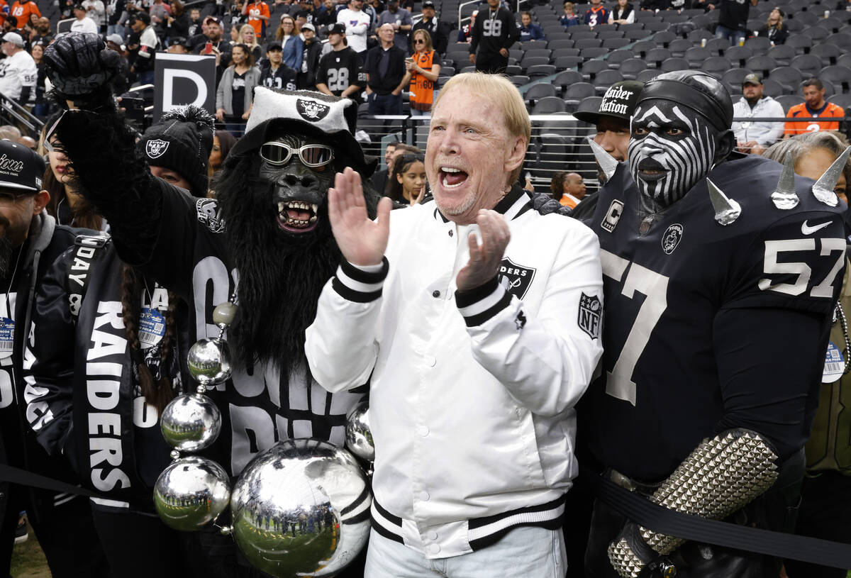 Raiders owner Mark Davis poses for a photo with fans prior to the start of an NFL football game ...