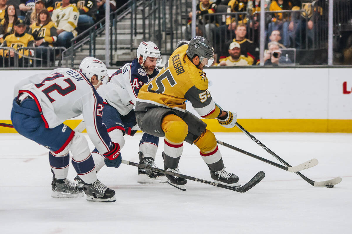 Golden Knights right wing Keegan Kolesar (55) leads the chase for the puck as Columbus Blue Jac ...