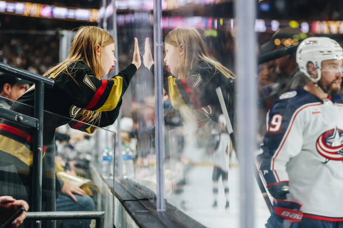 A young Golden Knights fan taunts Columbus Blue Jackets players during an NHL hockey game betwe ...