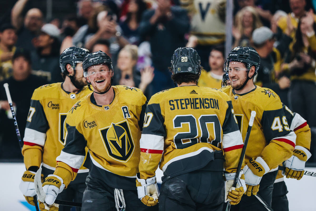 Golden Knights center Jack Eichel (9) celebrates his second goal of the night with his teammate ...