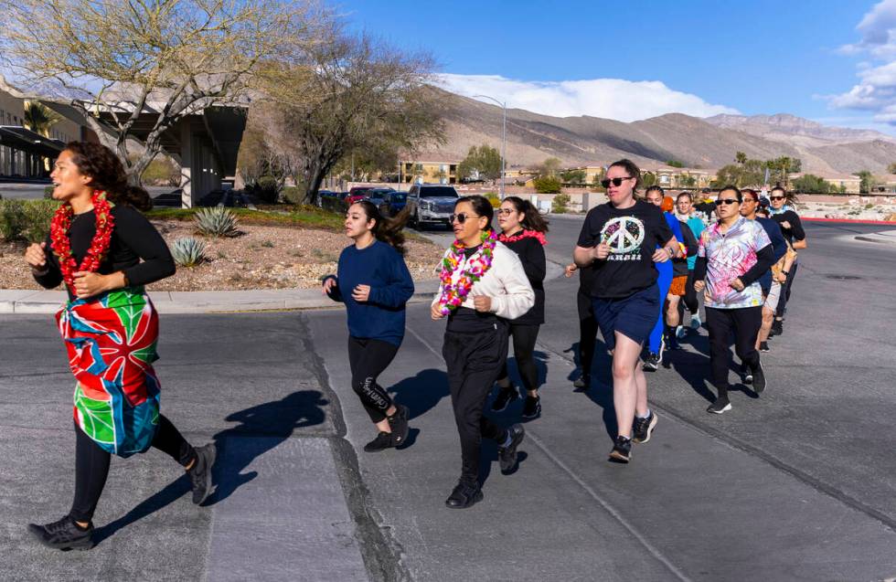 Attendees take a short warm up run before working out and learning defensive tactics with the M ...