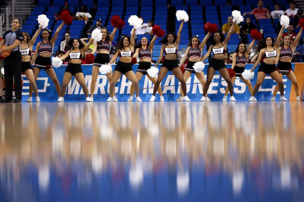 The UNLV Lady Rebels cheerleaders pump up their team during the first half of a first-round col ...