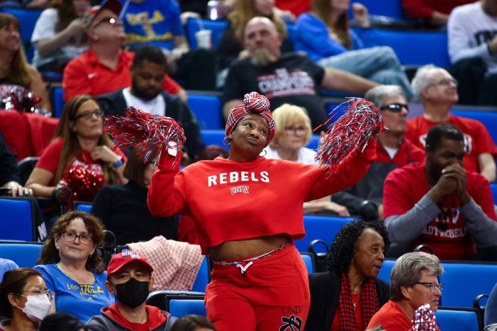 A UNLV Lady Rebels fan dances despite the team’s deficit during the second half of a fir ...