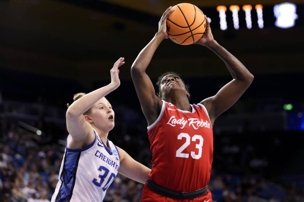 UNLV Lady Rebels center Desi-Rae Young (23) shoots against Creighton Bluejays forward Morgan Ma ...