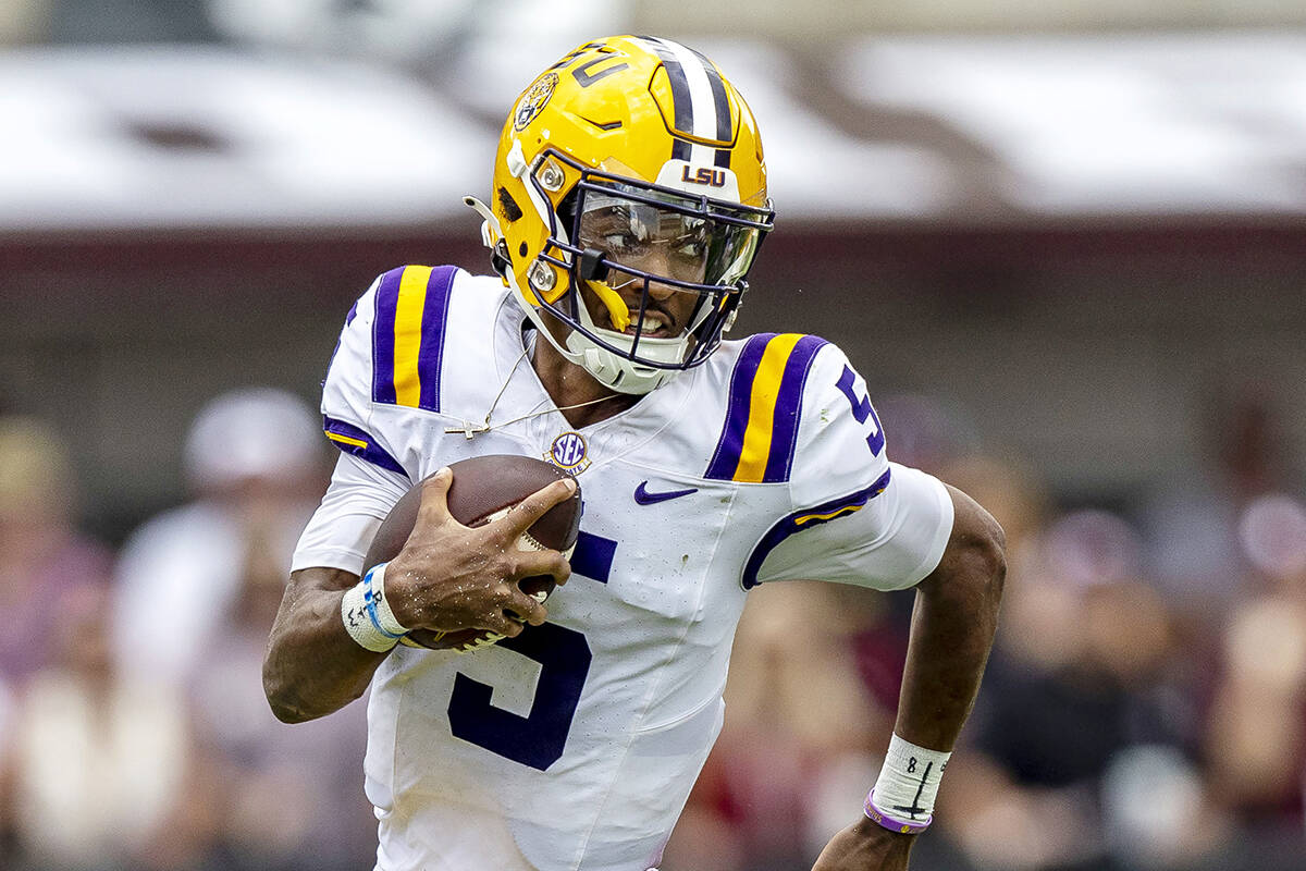 FILE - LSU quarterback Jayden Daniels (5) during the first half of an NCAA football game on Sa ...