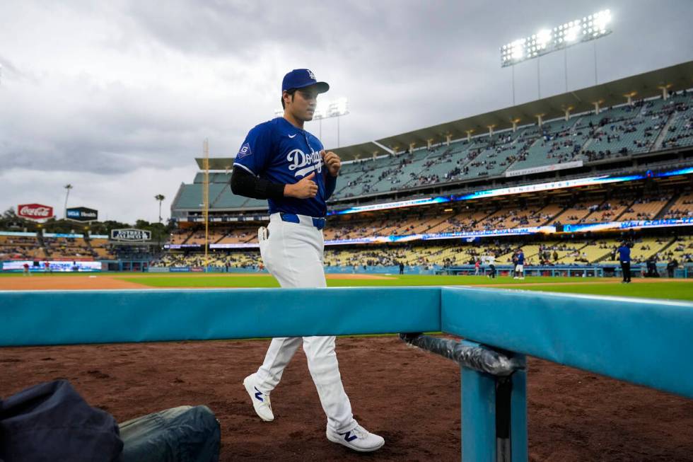 Los Angeles Dodgers designated hitter Shohei Ohtani (17) runs to the dugout before a spring tra ...
