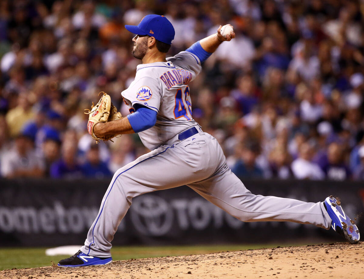 New York Mets relief pitcher Chasen Bradford throws to the plate against the Colorado Rockies d ...