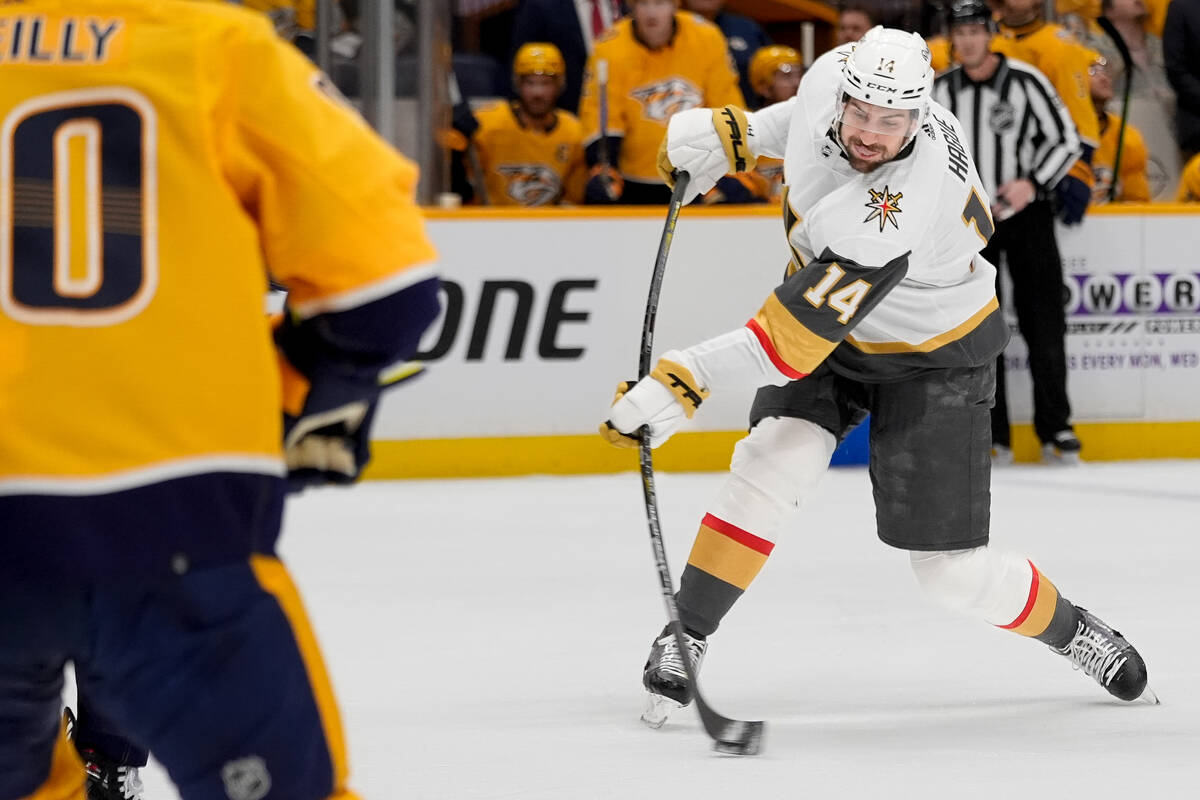 Vegas Golden Knights defenseman Nicolas Hague (14) shoots the puck during the first period of a ...