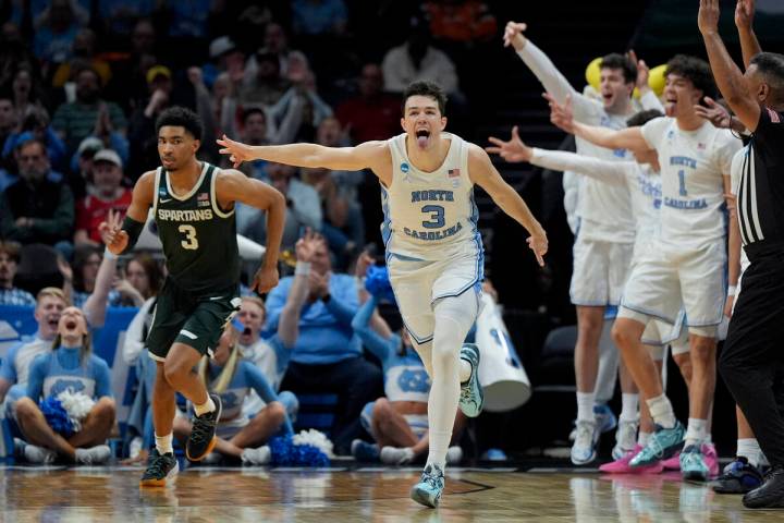 North Carolina guard Cormac Ryan (3) celebrates after scoring against Michigan State during the ...