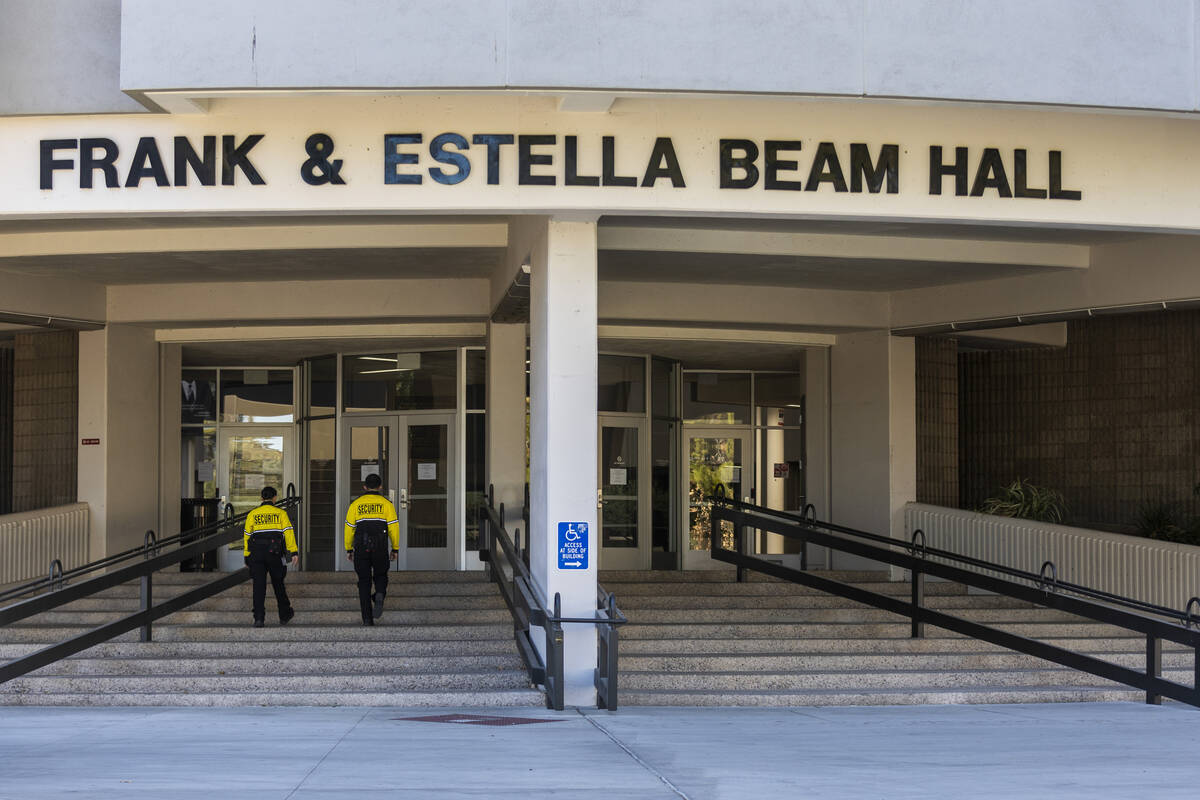 Security personnel walk into the Frank & Estella Beam Hall at UNLV on Tuesday, Jan. 16, 2024, i ...