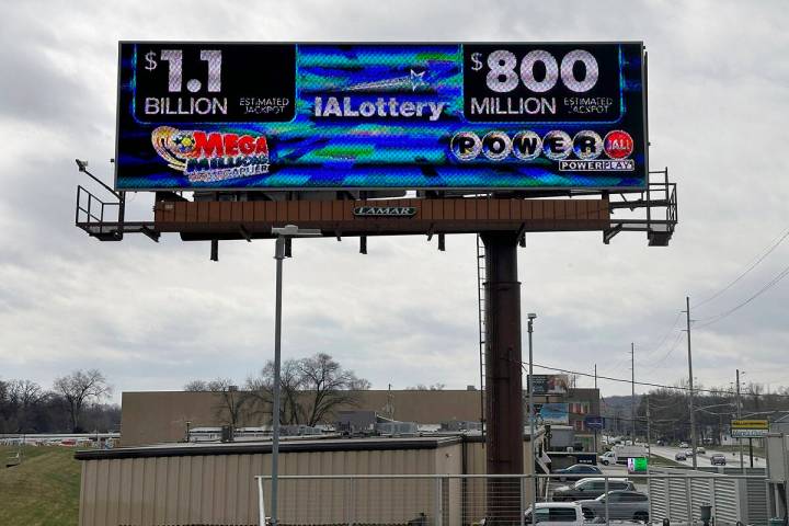 An electronic billboard advertises the Mega Millions and Powerball jackpots Monday, March 25, 2 ...