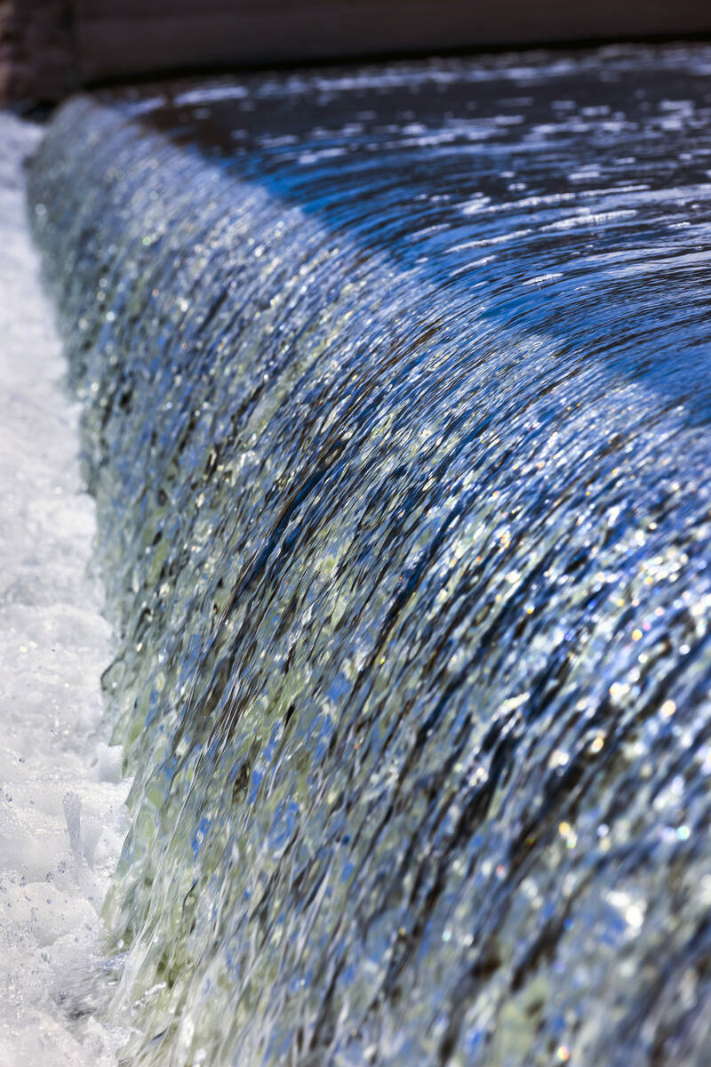 Water flows down the Rainbow Gardens Weir along the Las Vegas Wash on Thursday, Aug. 17, 2023, ...