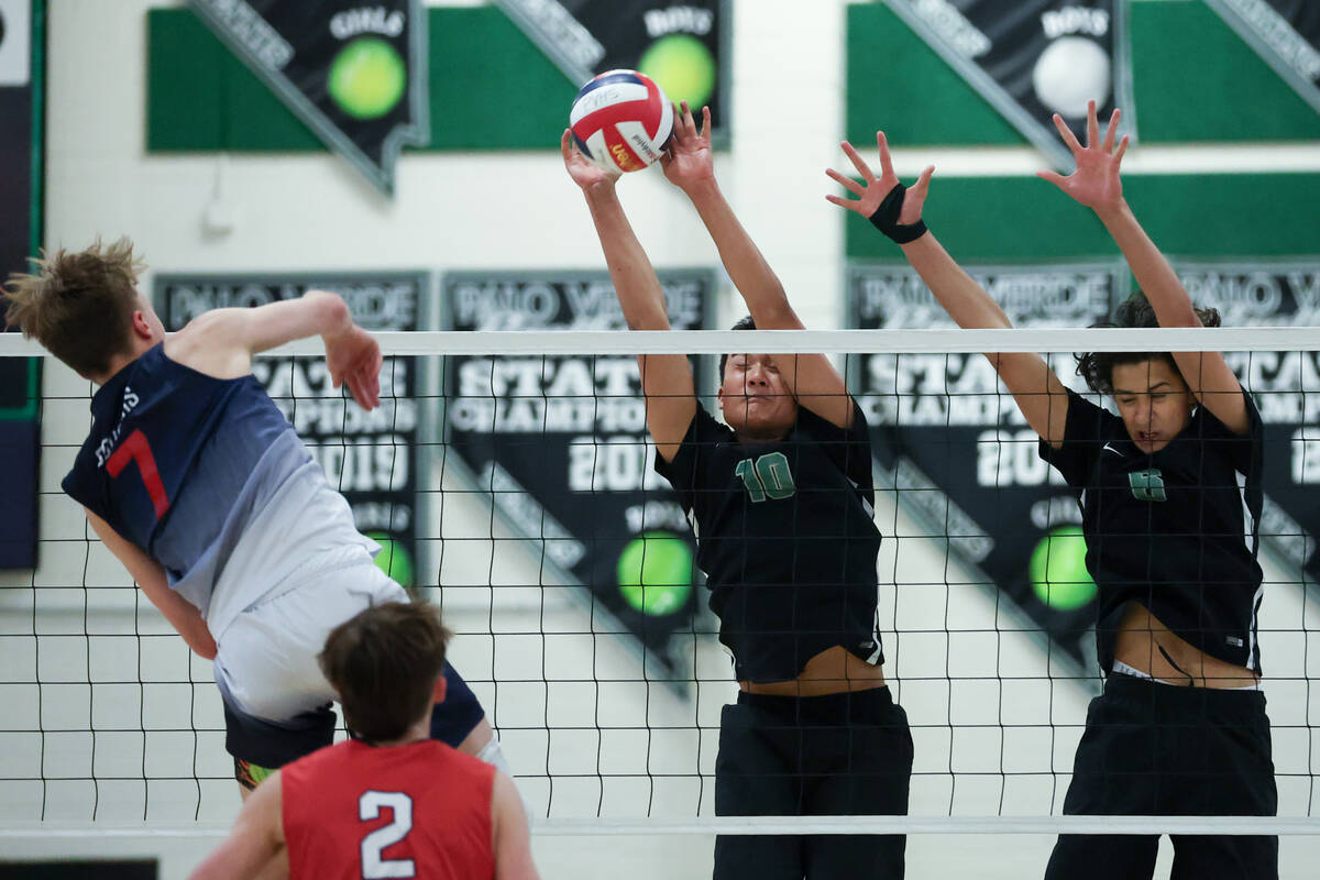 Palo Verde’s Dylan Ho (10) and Tama Smeltzer (6) jump to block a shot by Coronado&#x2019 ...