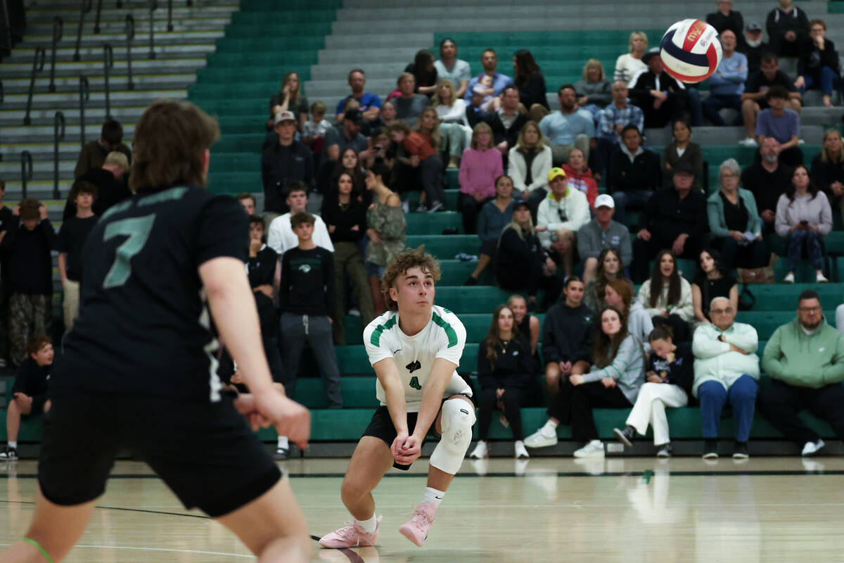 Palo Verde libero Dax Fish (4) bends to bump the ball during a boys high school volleyball gam ...