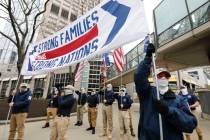 Members of the Patriot Front protest across the street from the Marrow Hotel in opposition to S ...