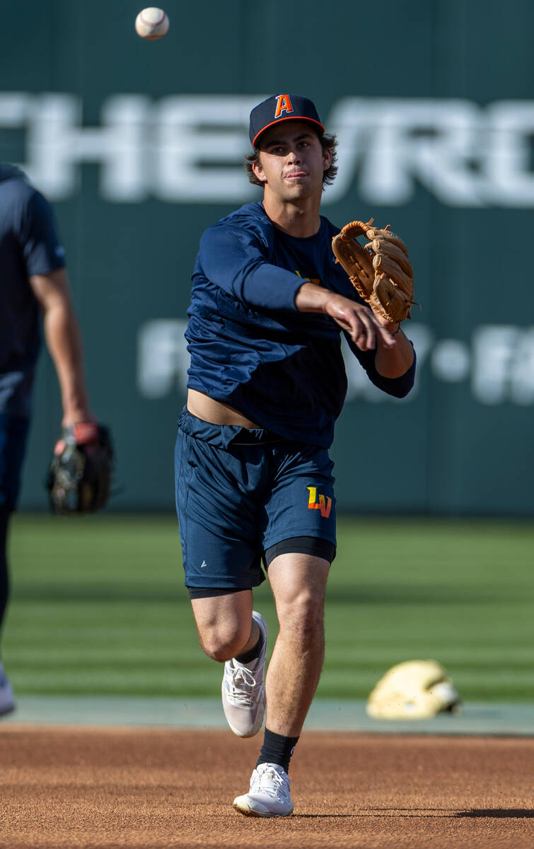 Aviators shortstop Max Muncy throws to first base during practice at the Las Vegas Ballpark on ...