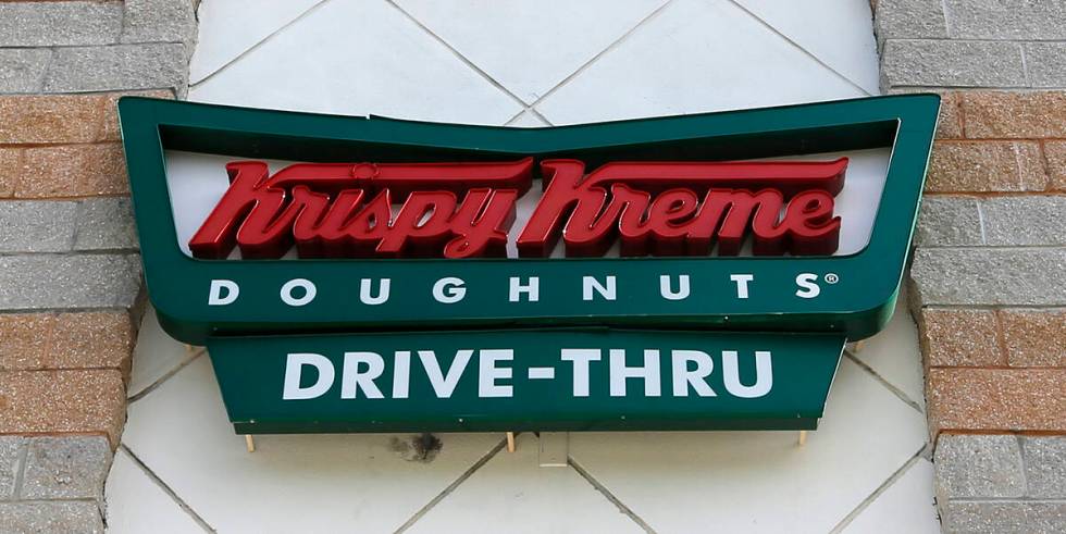 A Krispy Kreme Doughnuts sign is shown on Aug. 11, 2017, in Miami. Krispy Kreme stock jumped Tu ...