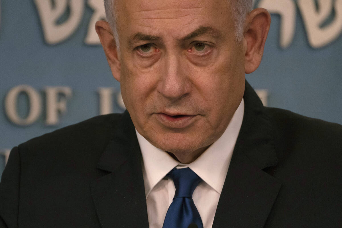 Israeli Prime Minister Benjamin Netanyahu delivers his speech after a meeting with German Chanc ...