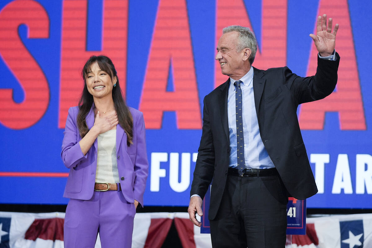 Presidential candidate Robert F. Kennedy Jr. waves on stage with Nicole Shanahan, after announc ...