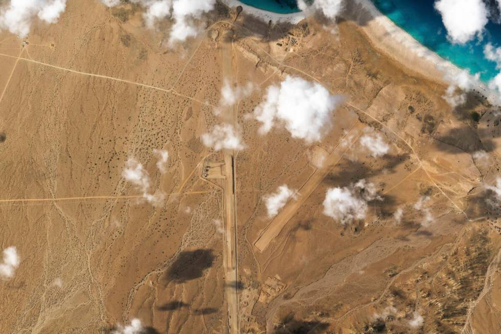 This satellite photo captured by Planet Labs PBC shows the construction of an airstrip on Abd a ...