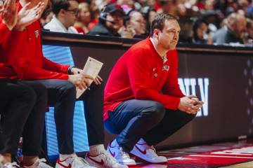 UNLV head coach Kevin Kruger watches game action during a second-round NIT game between Boston ...