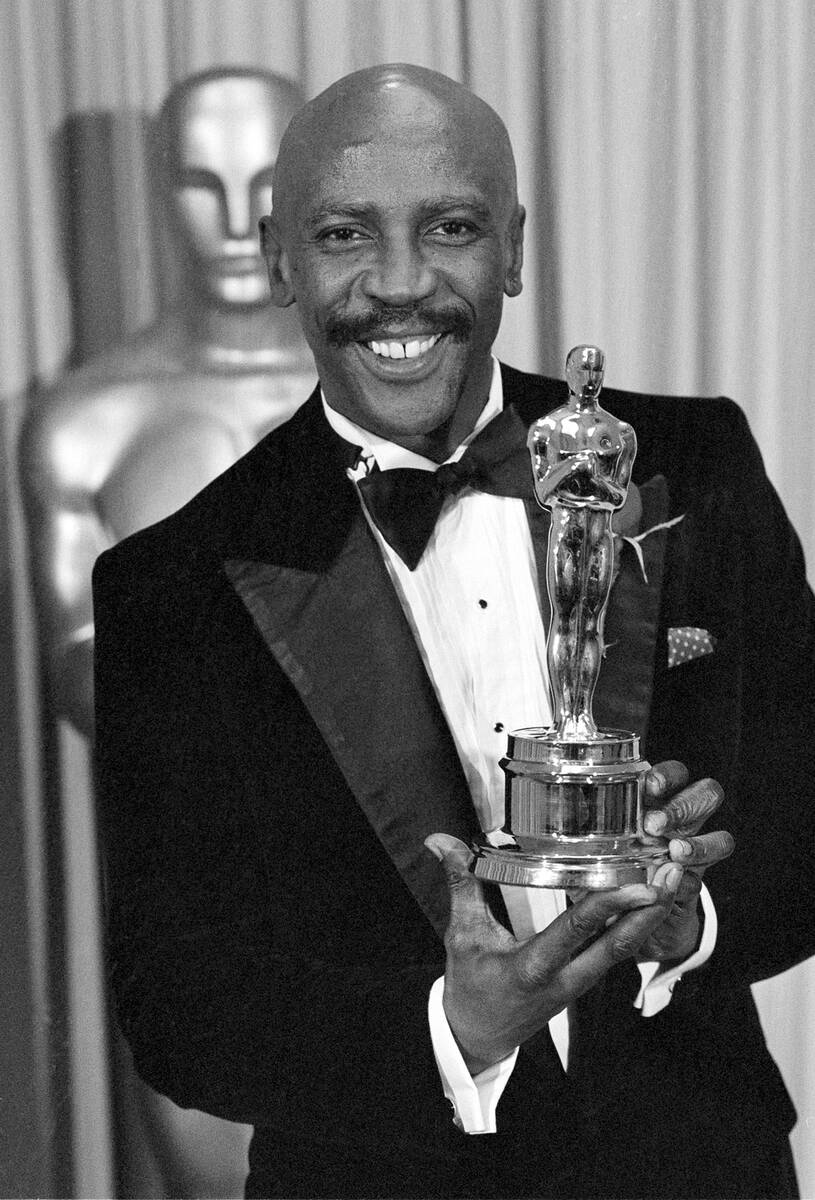 FILE - Louis Gossett Jr., poses with the Oscar for best supporting actor for his role in " ...