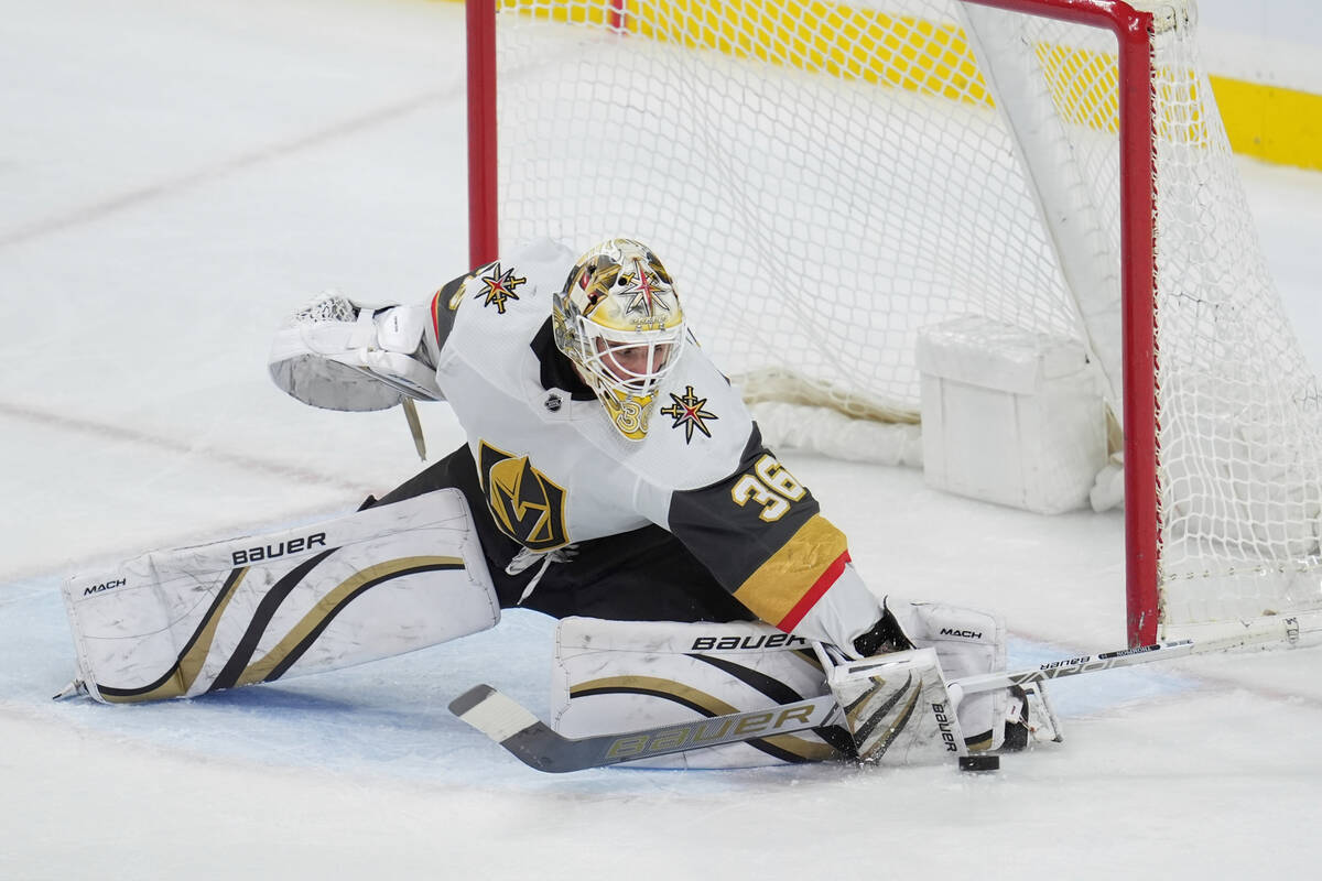 Vegas Golden Knights goaltender Logan Thompson (36) stops a shot during the third period of an ...