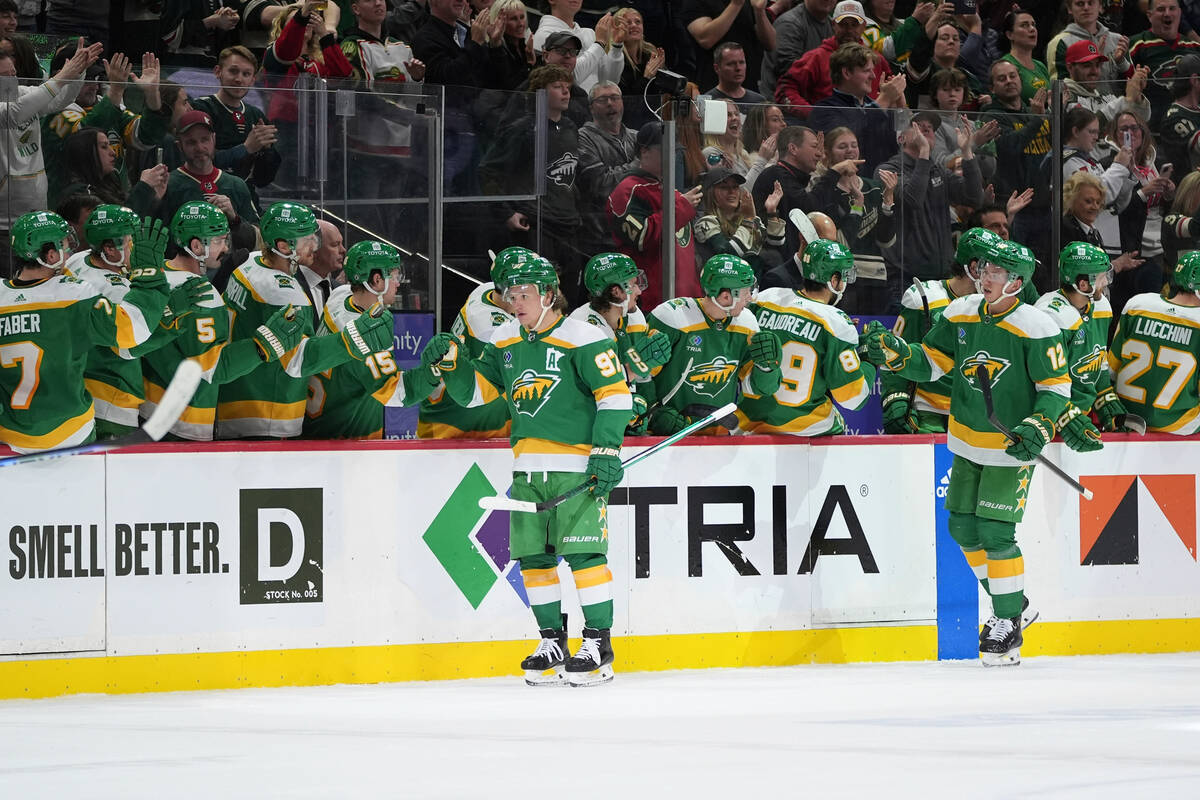 Minnesota Wild left wing Kirill Kaprizov, front left, celebrates with teammates after scoring d ...