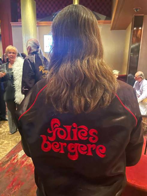 Jan Russell, a former Folies Bergere dancer, displays her varsity jacket from the show while at ...