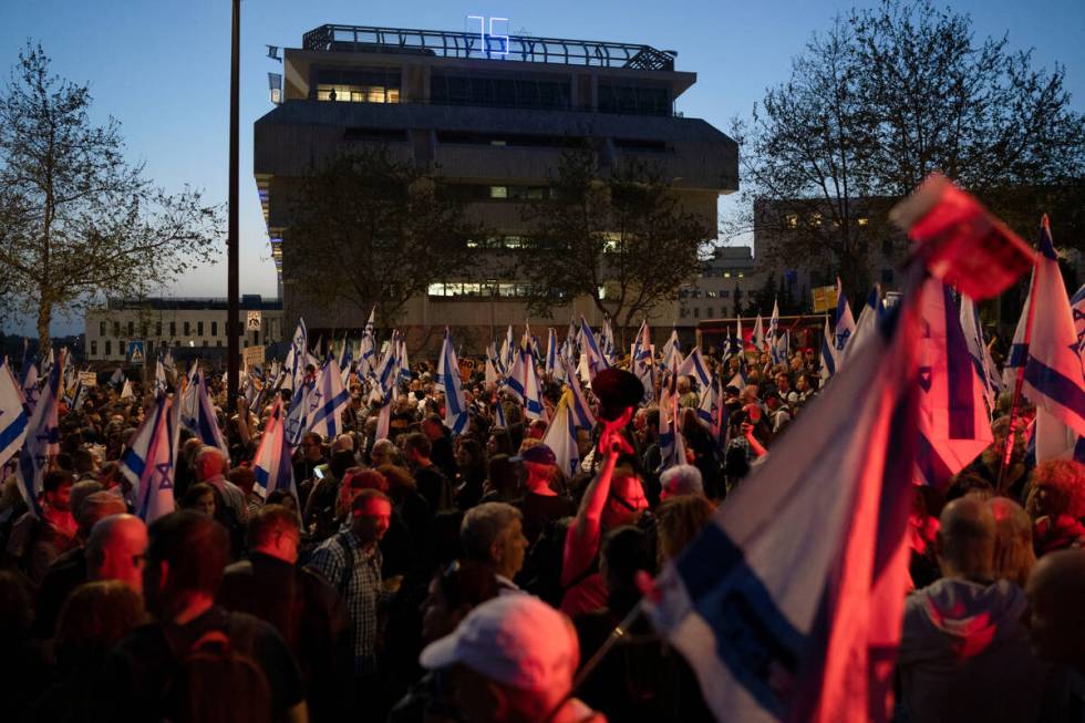 People take part in a protest against Israeli Prime Minister Benjamin Netanyahu's government an ...