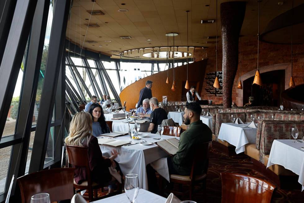 Customers eat lunch in the soaring glass-walled dining room of Panevino in Las Vegas. (Chitose ...
