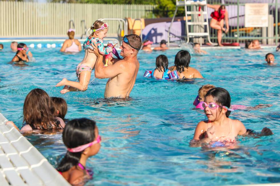 A large crowd of people came out to beat the heat at the Splash Back to School Party and School ...