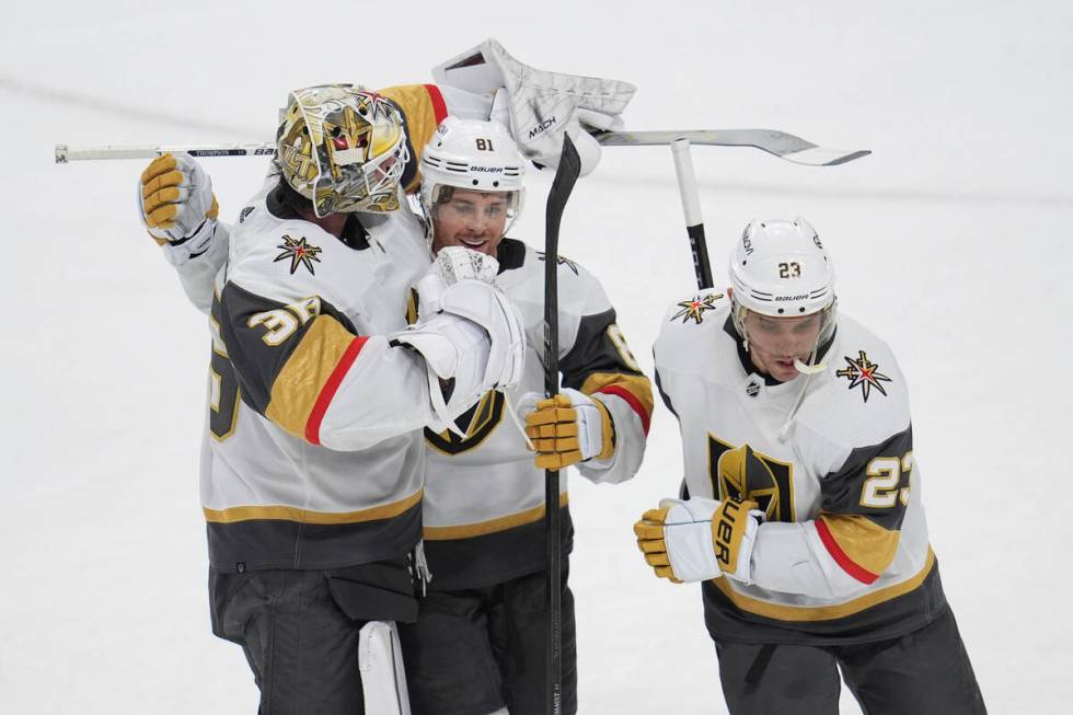 Vegas Golden Knights goaltender Logan Thompson, left; right wing Jonathan Marchessault, center; ...