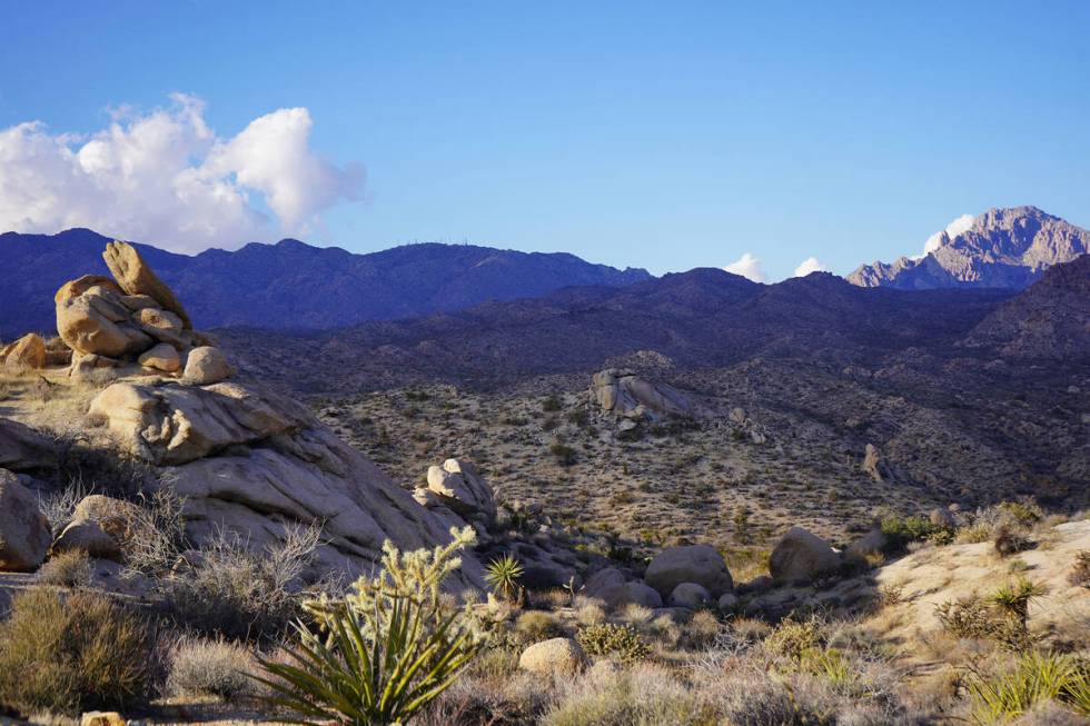 Spirit Mountain, seen as the prominent point to the right in this photograph, is a religiously ...