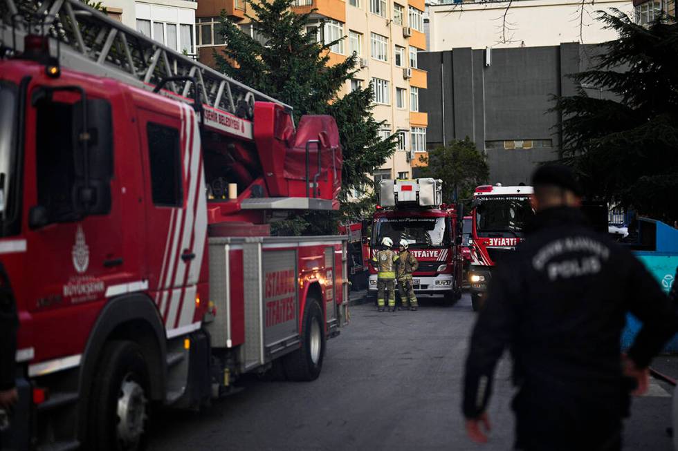 Firefighters work after a fire broke out in a nightclub in Istanbul, Turkey, Tuesday, April 2, ...