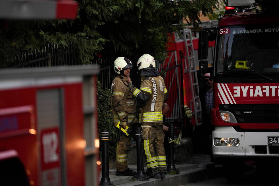 Firefighters work after a fire broke out in a nightclub in Istanbul, Turkey, Tuesday, April 2, ...