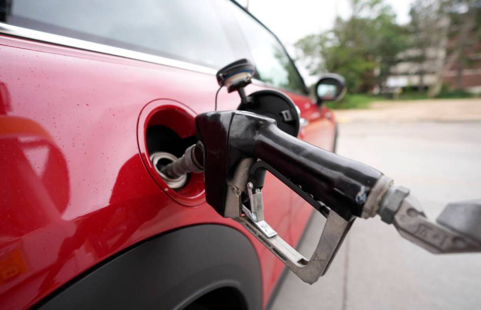 A motorist fills up the tank of a vehicle at a Shell station Wednesday, July 5, 2023, in this A ...